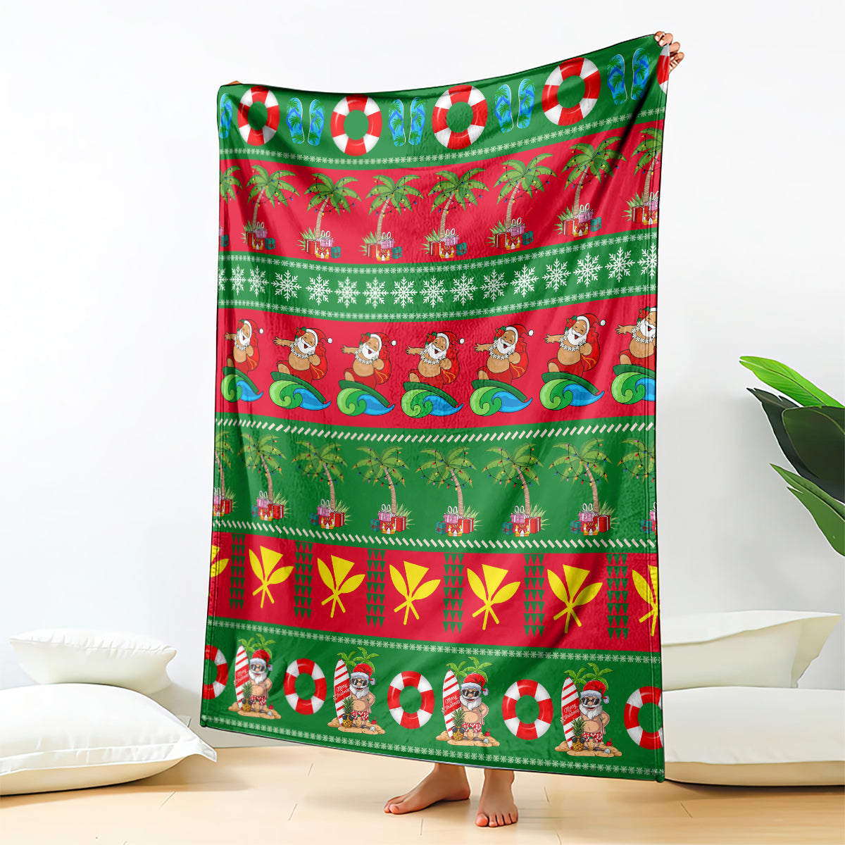 Green Christmas blanket with red panels, palm trees, candy canes, and Santa figures