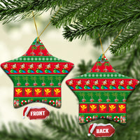 Ceramic star-shaped Christmas ornament with red-and-green tropical holiday pattern