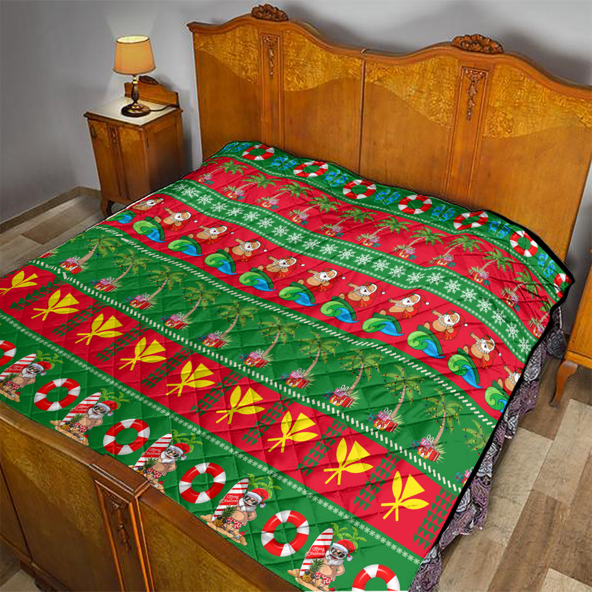 Hawaiian Christmas quilt on bed, green and red panels with palm trees, waves, holly, and Santa