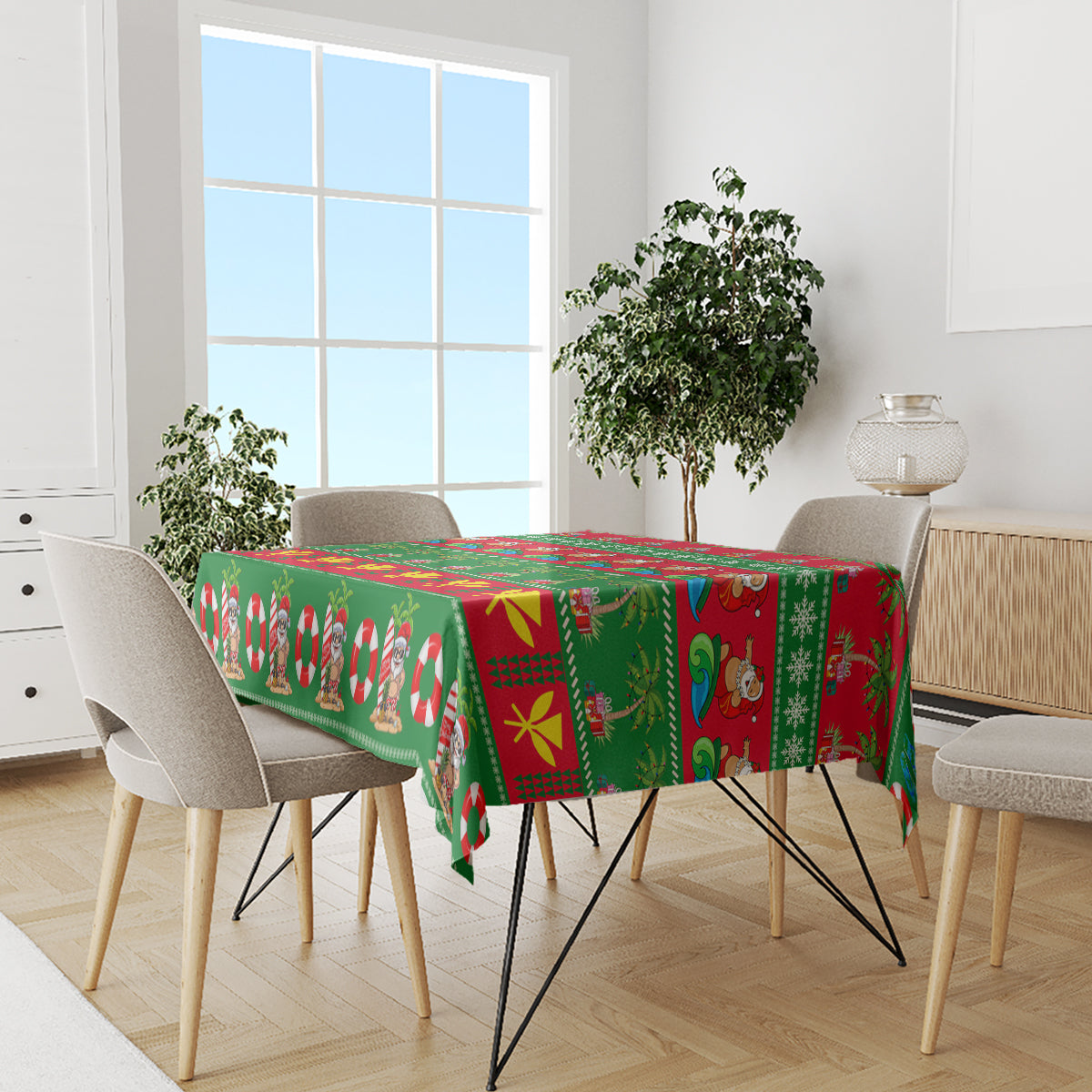 Green Christmas tablecloth on dining table with Santa and candy cane motifs