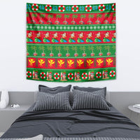 Wall hanging Christmas tapestry in red and green with tropical palm and holly motifs