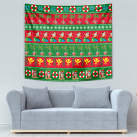 Red and green Christmas tapestry with tropical palm rows, gift symbols, and festive figures