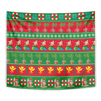 Close-up Christmas tapestry in red and green with palm trees, candy, and holiday icons