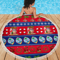 Round beach blanket with red-blue holiday graphic print and white fringe edge