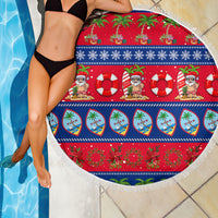 Round beach blanket with red-blue holiday print, life rings, and fringed edge