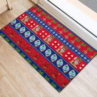 Blue Christmas rubber doormat with striped candy-cane, ornament and holly design