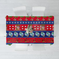 Guam Christmas tablecloth in blue with red, palm, and holiday character print