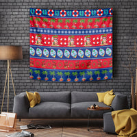 Guam Christmas tapestry with red, blue, and green festive patterns, palms, and holiday characters