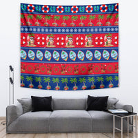 Festive Christmas tapestry with palm beach pattern, red/blue stripes, and smiling holiday characters