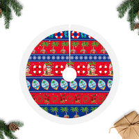 Blue and red circular Christmas tree skirt with tropical Guam print and white fringed border