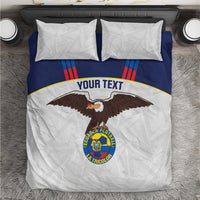 White and navy football bedding set with eagle crest and two matching pillowcases.