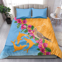 Bedding set with two blue pillowcases and orange duvet cover, dove, dolphins, and pink flowers
