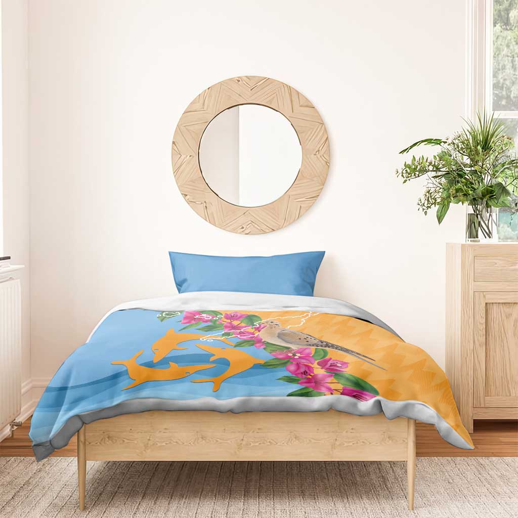 Bedding set with blue pillowcase and orange-blue duvet, dove, dolphins, and pink blossoms