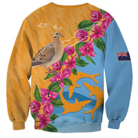 Orange sweatshirt with blue right sleeve, floral print, dove graphic, and flag patch