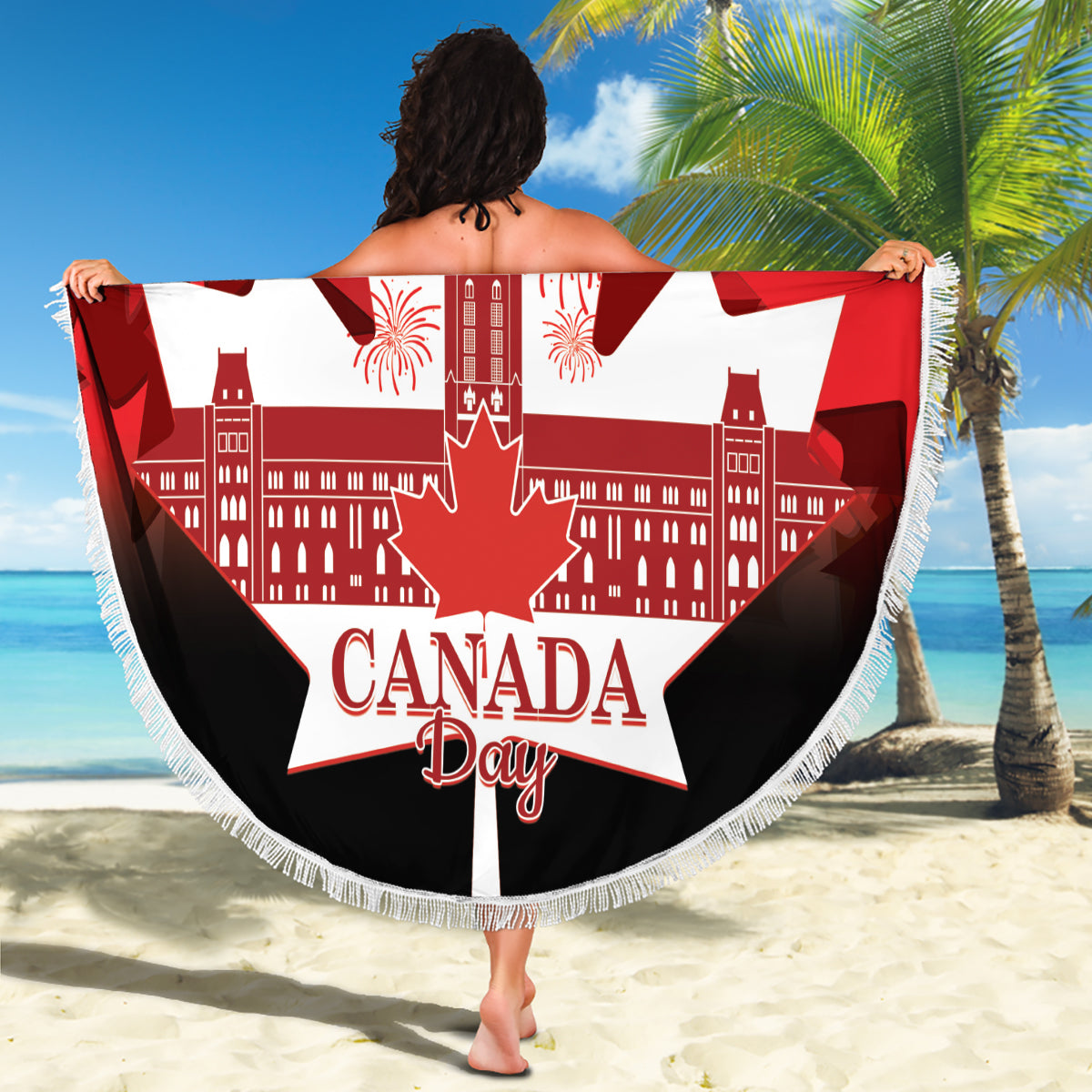 Red and black round beach blanket with Canada Day text, white maple leaf, fringed border