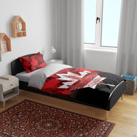 Red and black bedding set with maple leaf pattern and "Canada Day" graphic on duvet