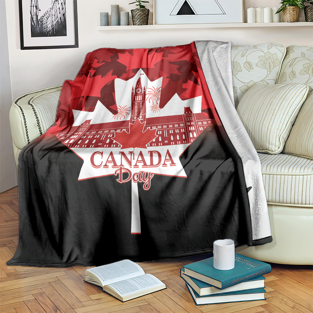Canada Day blanket draped on a sofa with red maple leaves, white skyline and “Canada Day”