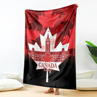Canada Day blanket in red and black with maple leaf pattern, white skyline, “Canada Day” text