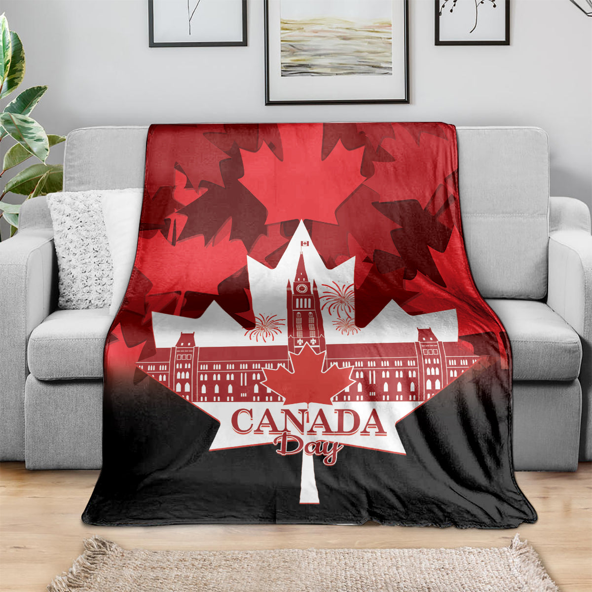 Canada Day throw blanket showing red maple leaves over a white city skyline with “Canada Day”