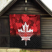 Red and black quilt hanging in doorway, featuring white maple-leaf city and Canada Day text.