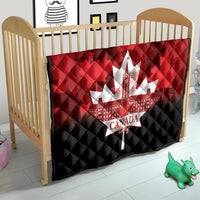 Canada Day quilt on wooden crib, red-and-black with white maple-leaf city centerpiece.