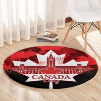 Red round Canada Day rug with black border, white star, skyline and maple leaf pattern