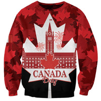 Red crewneck sweatshirt with Canada Day text over white maple-leaf star skyline