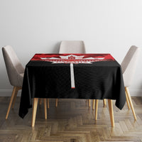 Canada Day tablecloth with red maple leaf design and white Canada Day emblem on table
