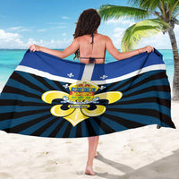 Blue Quebec sarong wrap with central crest, fleur-de-lis, and navy/teal stripes