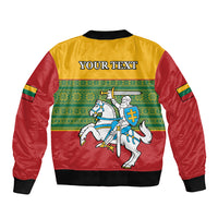 Red and yellow bomber jacket with green folk pattern, horse-and-knight crest, 'YOUR TEXT' on back