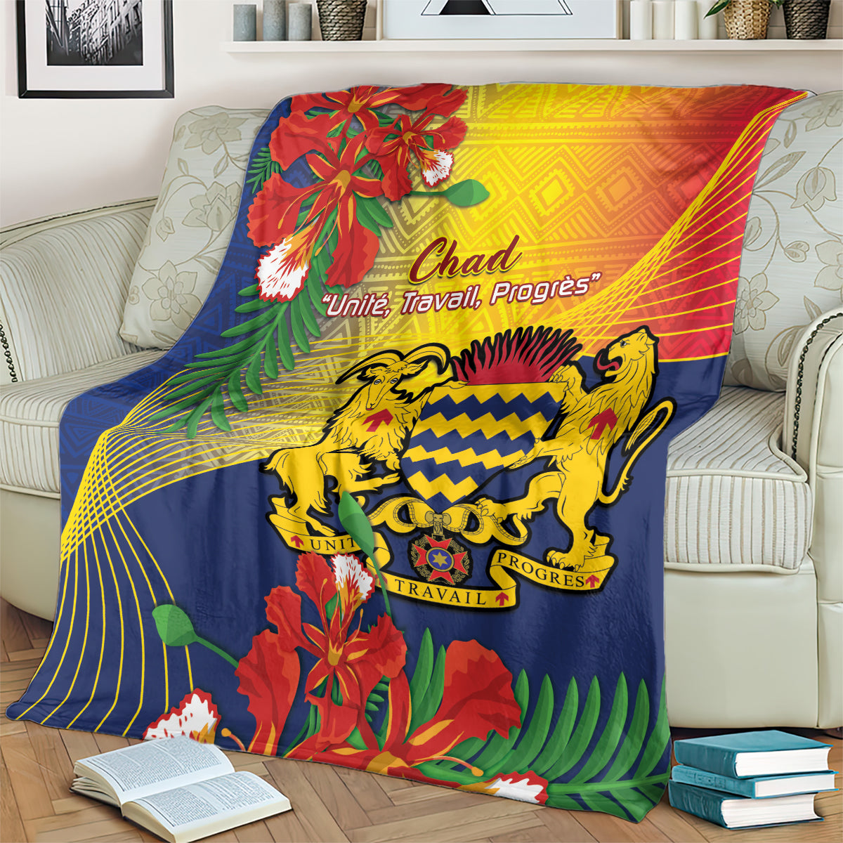 Blue tropical print blanket on sofa with lion crest and red-yellow swirls