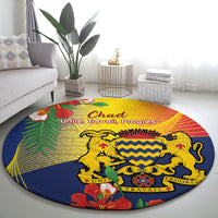 Round blue round carpet with yellow, red, green emblem and lions graphic
