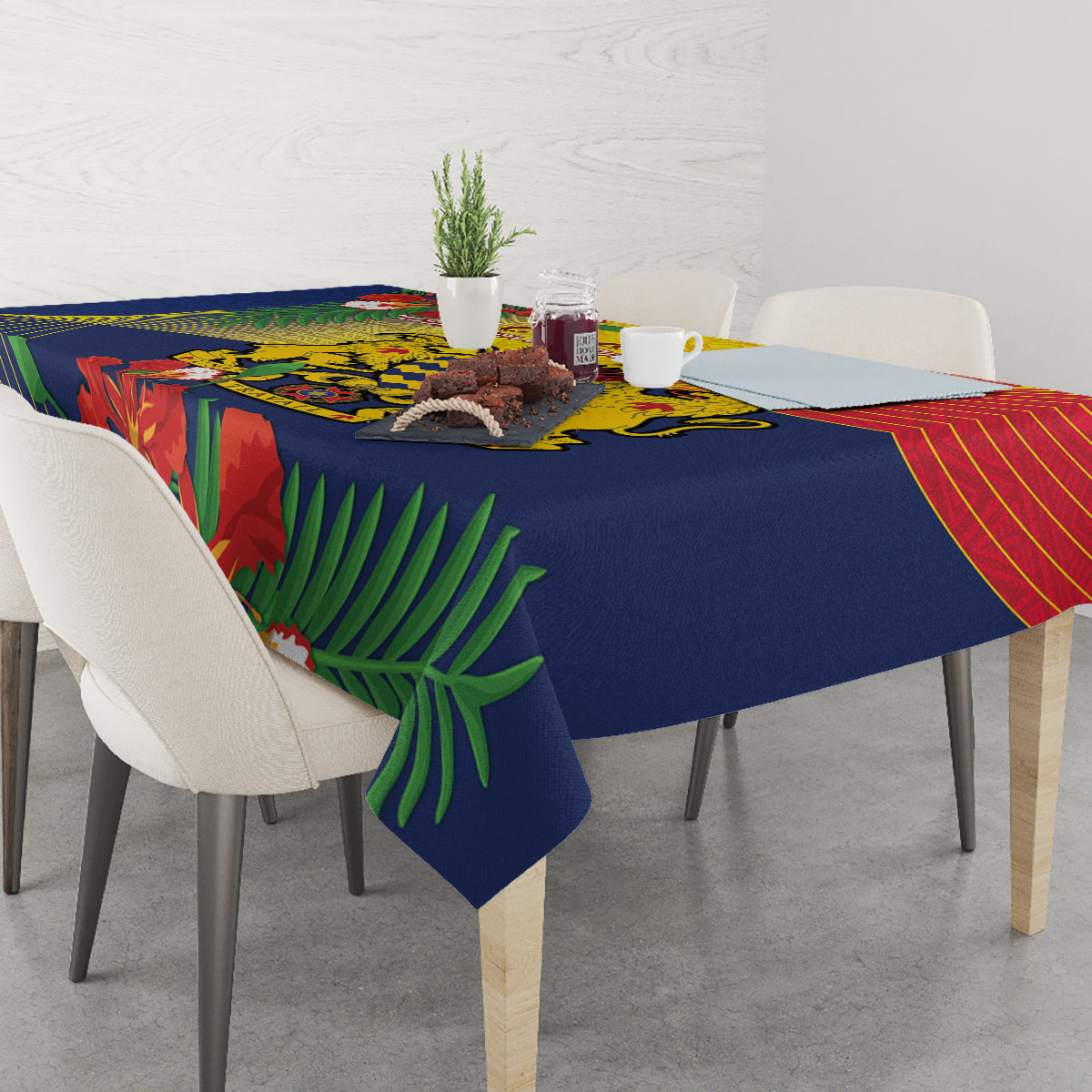 Blue tablecloth with tropical leaf and red-yellow stripe design on dining table