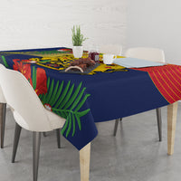 Blue tablecloth with tropical leaf and red-yellow stripe design on dining table