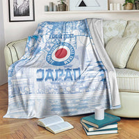Blue Japan football blanket with city map, floral graphics, and circular red emblem