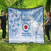 Blue and white quilt with Japan football emblem, city map lines, and cherry blossom flowers