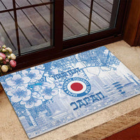 Blue rubber doormat with floral and city map design and round Japan crest centered