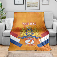 Orange Netherlands rugby blanket draped with custom text, crest, and flag stripes