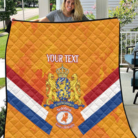 Orange Netherlands rugby quilt with quilted diamond pattern and crest in center