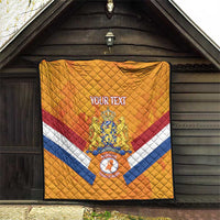 Orange Netherlands rugby quilt hanging outdoors, with diamond pattern, stripes, and crest