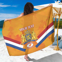 Orange rugby sarong fully spread, diagonal navy and red stripes with Netherlands crest