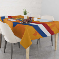 Orange tablecloth with Netherlands-style banner graphic, blue diagonal stripes, and red accents