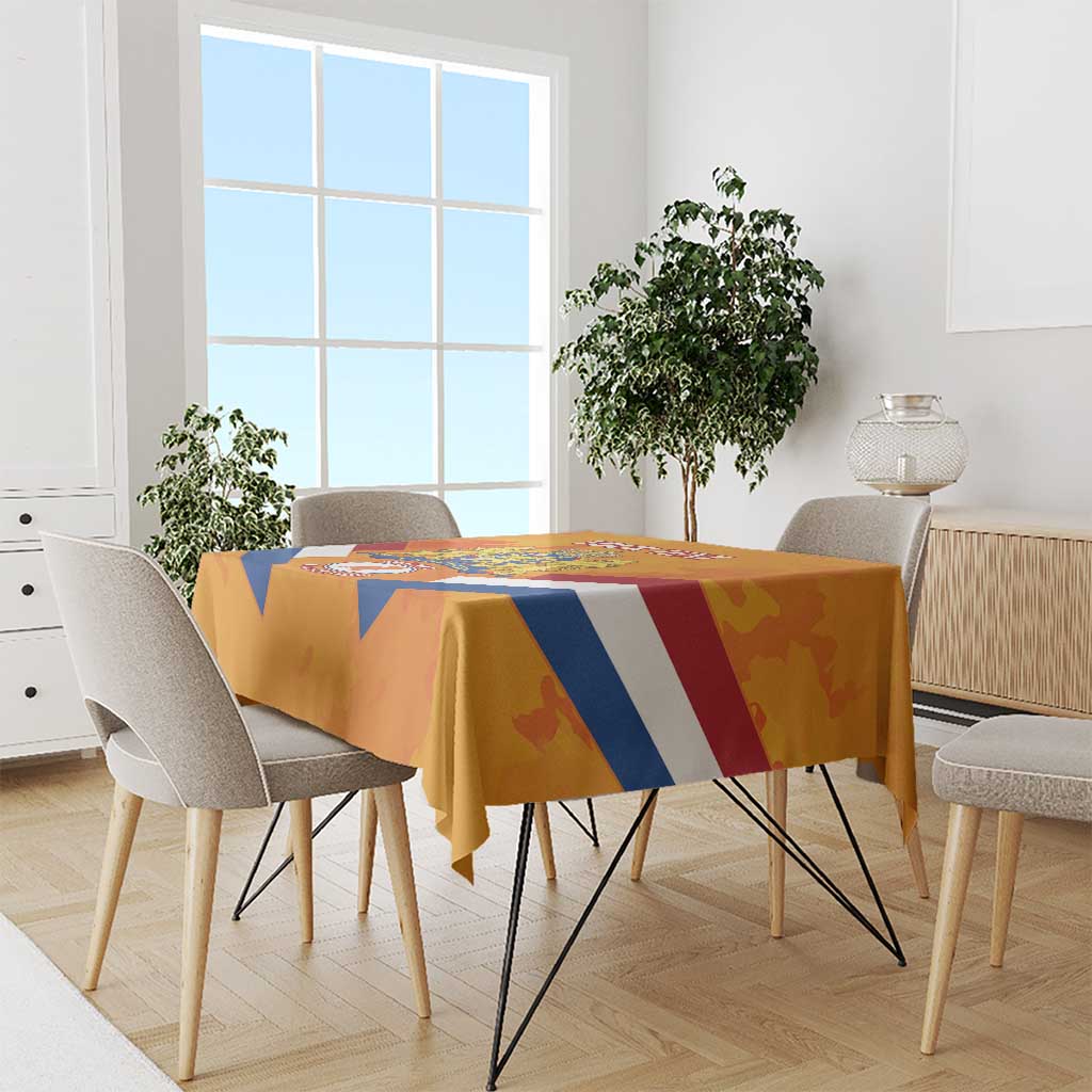 Orange tablecloth on dining table with Netherlands banner design in blue, white, and red
