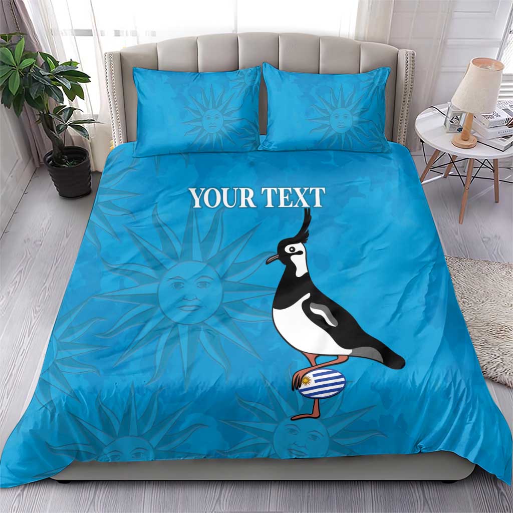 Blue bedding set with two pillowcases, "YOUR TEXT" graphic and penguin illustration