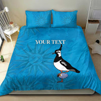Blue duvet cover bedding set with two pillowcases, sun pattern and penguin illustration