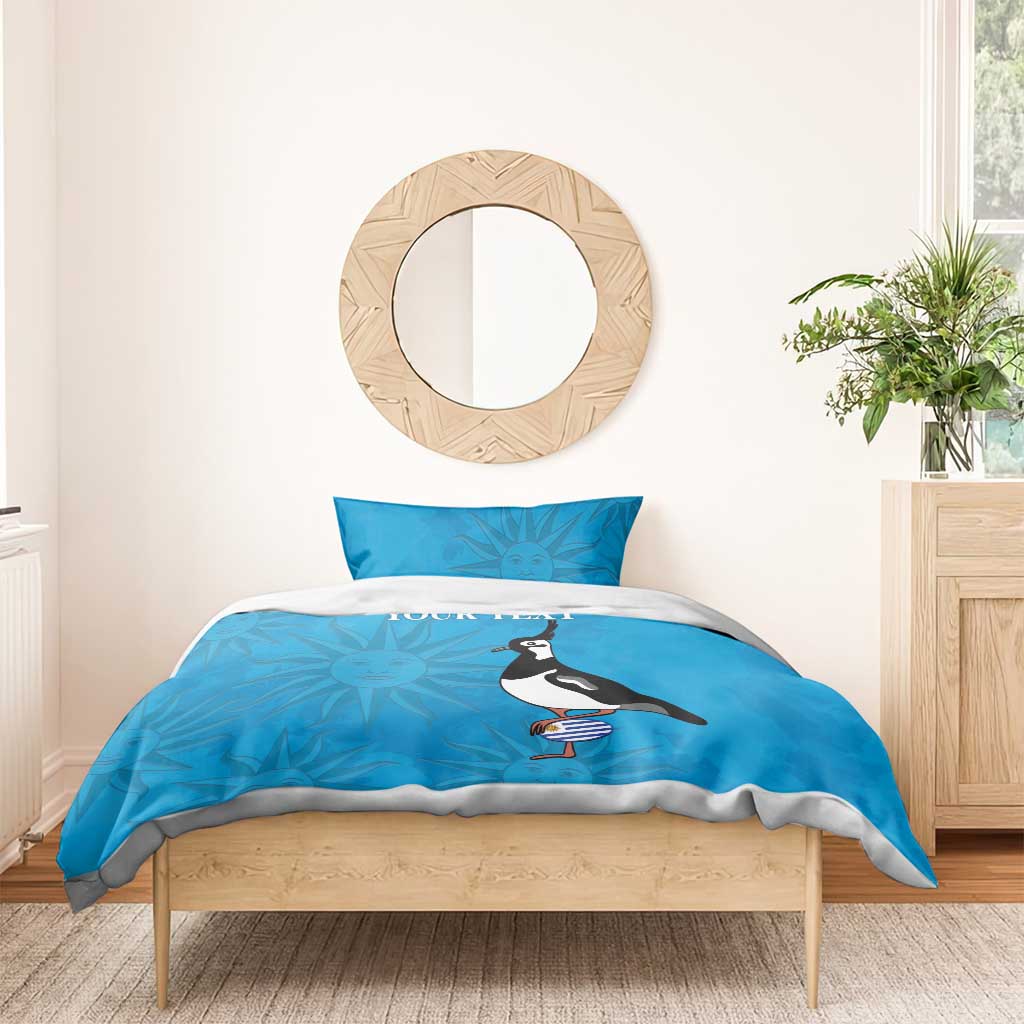 Blue bedding set with two pillowcases, penguin holding striped bottle, sun graphic