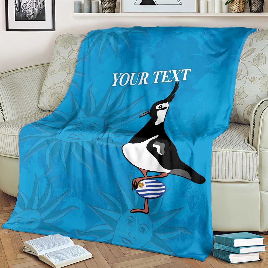 Blue custom rugby blanket on armchair with 'YOUR TEXT' and penguin graphic