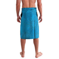 Blue shorts with subtle leaf print, back view