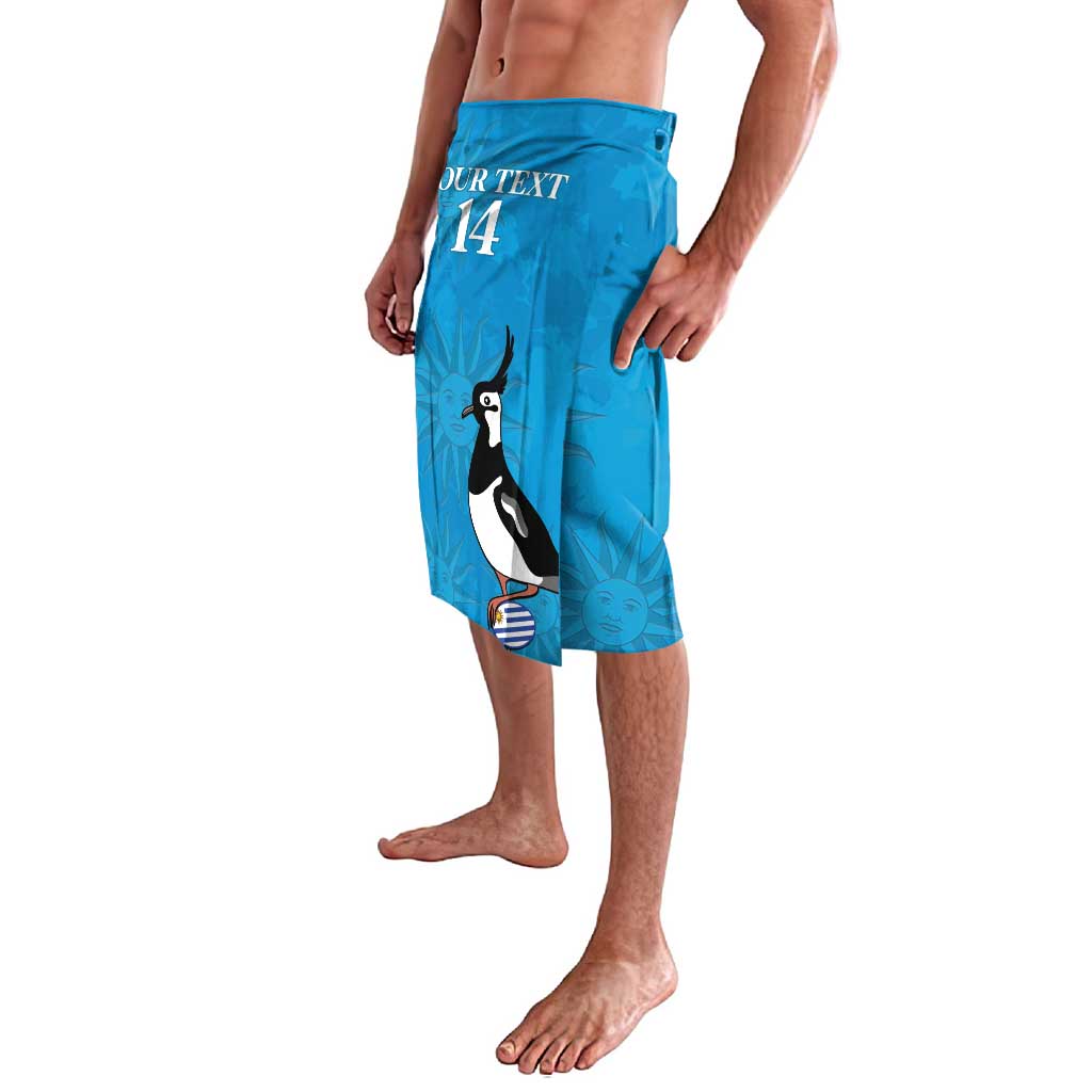 Blue shorts with penguin graphic and number 14, side view