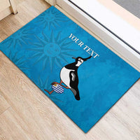 Blue rubber doormat with bird graphic and centered 'YOUR TEXT' banner